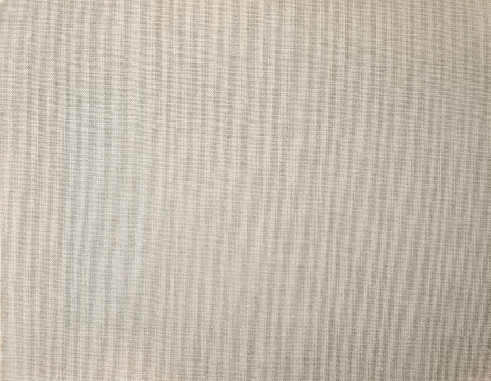 Close-up of a textured linen-effect wall covering in warm beige