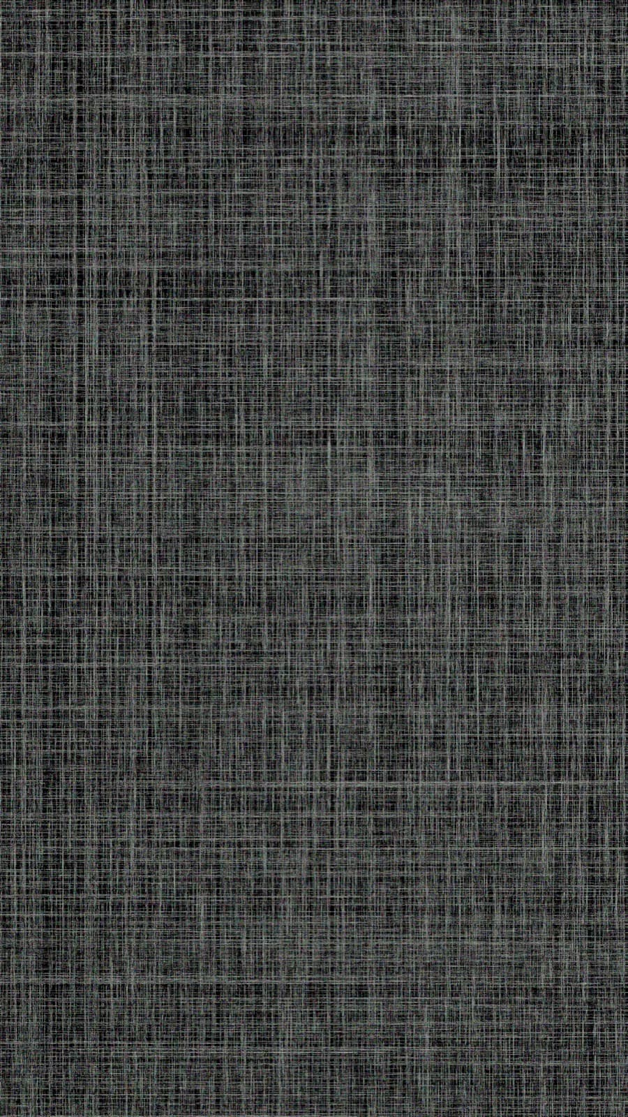 Close-up of a dark charcoal grasscloth-effect wall covering