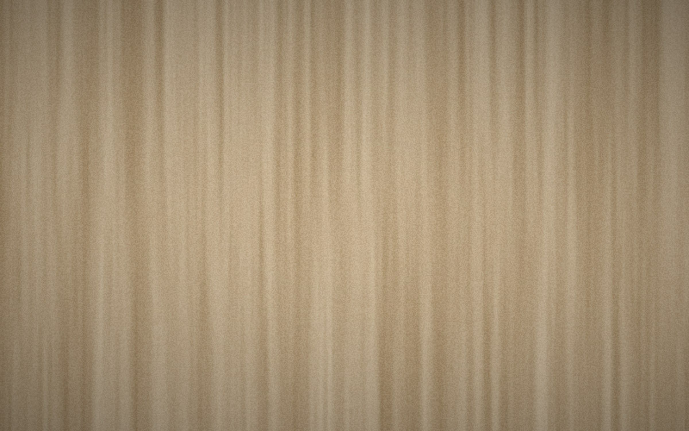 Close-up of a warm natural fibre wall covering, softly lit