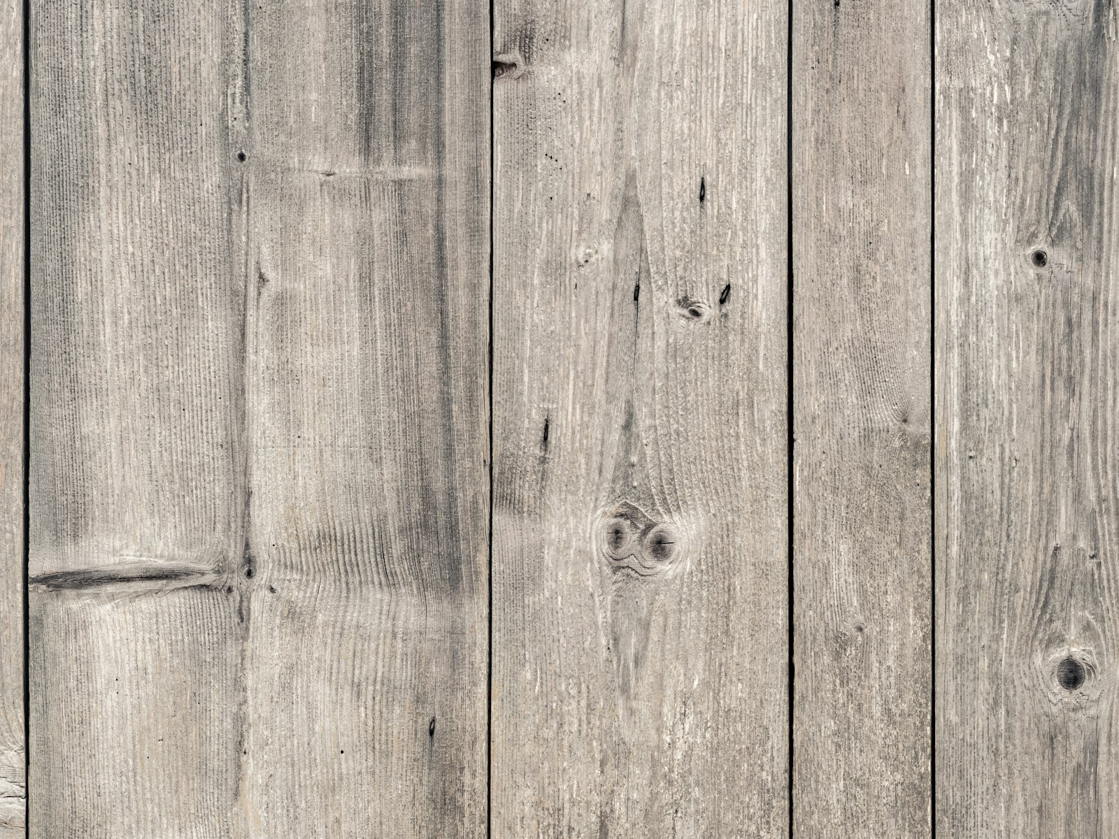 Weathered silver-grey timber cladding planks
