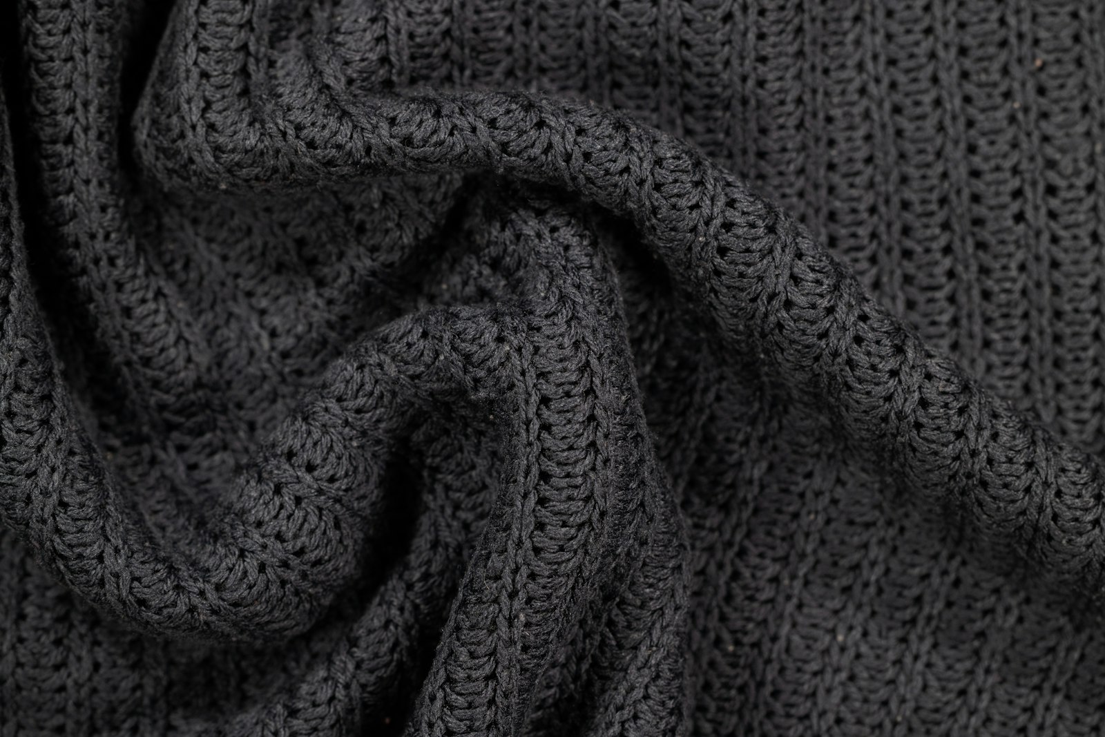Close-up of a charcoal knitted fabric