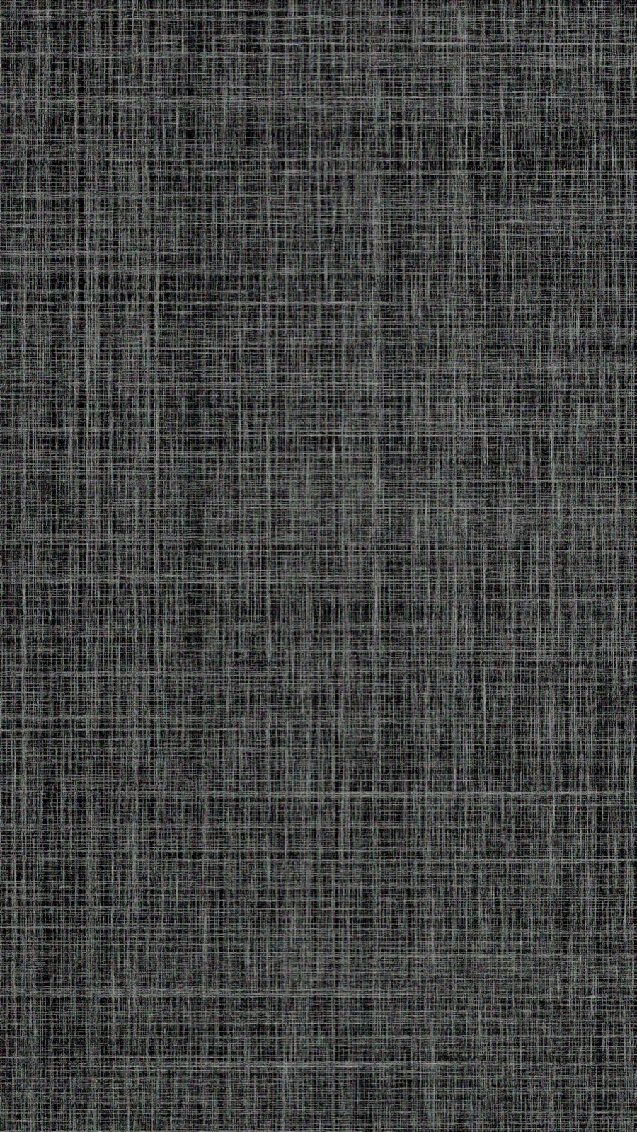 Close-up of a dark charcoal grasscloth-effect wall covering